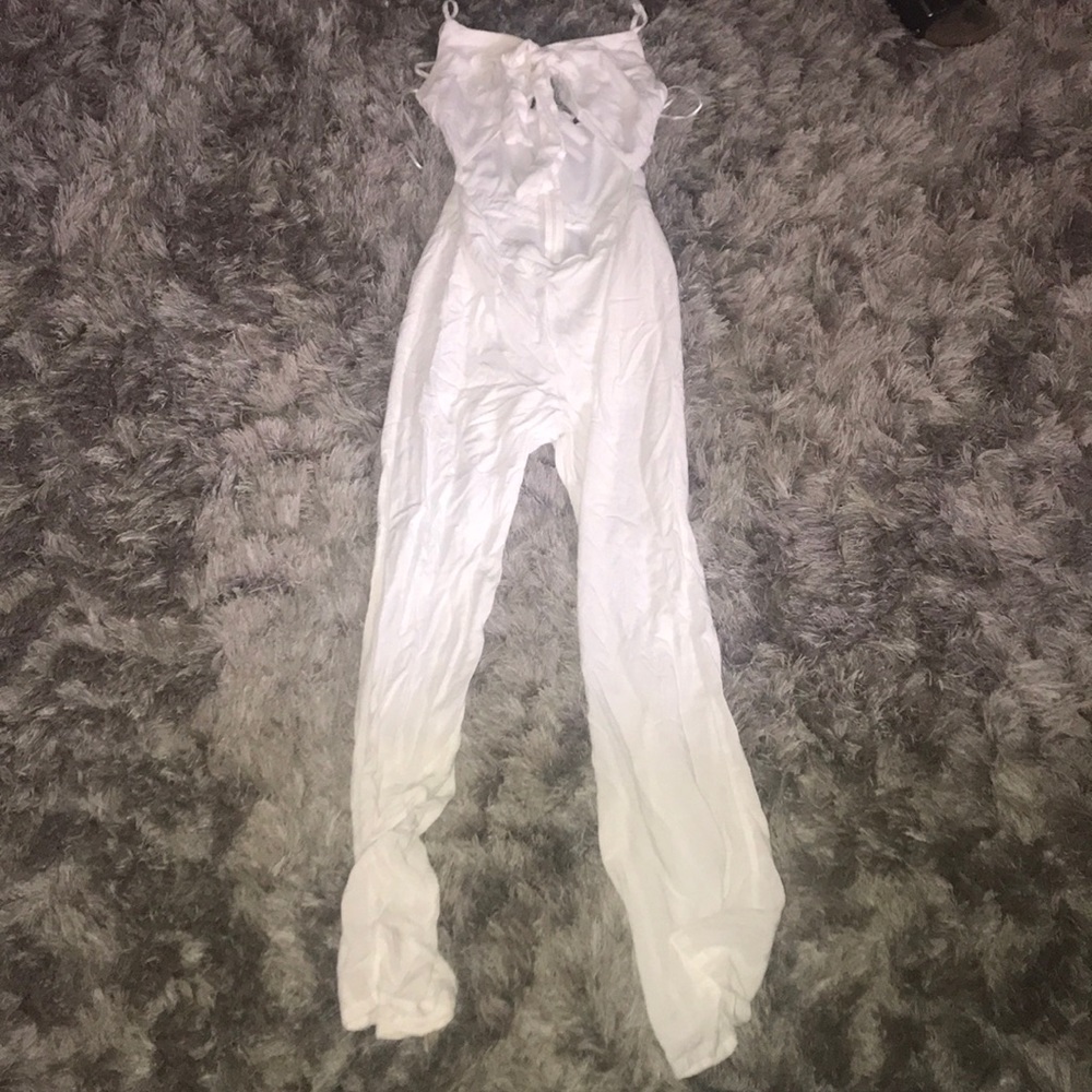 White jump suit with a opening in the stomach area
